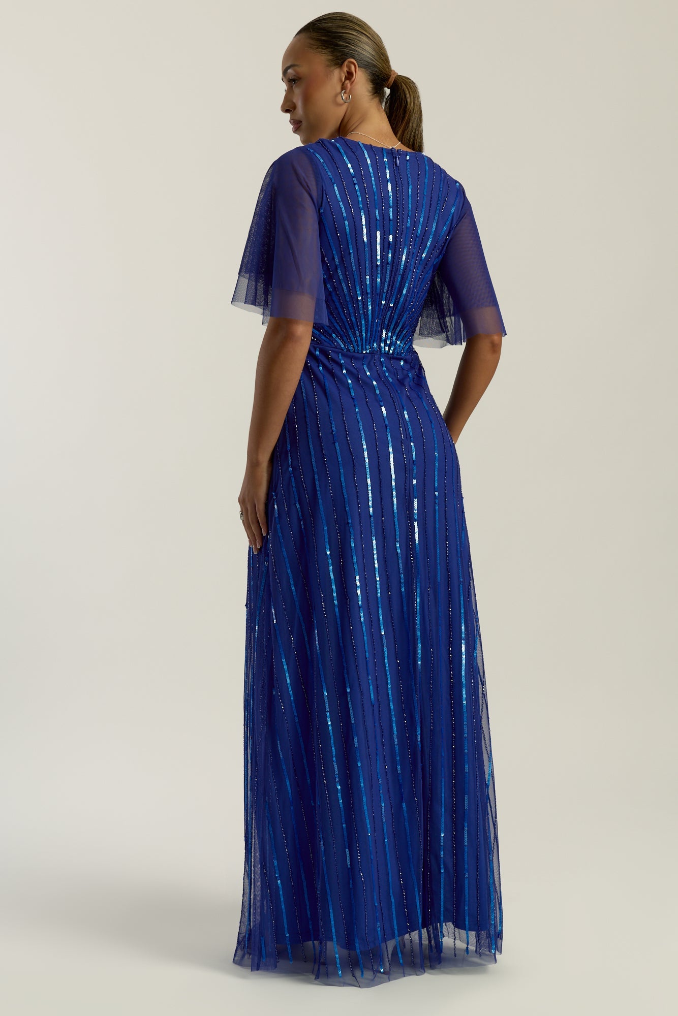 Harper Electric Blue Sequin Maxi Dress with v-neckline and full-length silhouette, perfect for weddings, balls, formal occasions and bridesmaids.