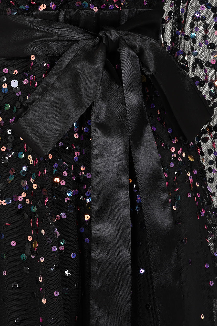 Iris black iridescent sequin maxi dress with V neckline, sheer sleeves and tiered skirt designed for elegant evening and occasion wear styling