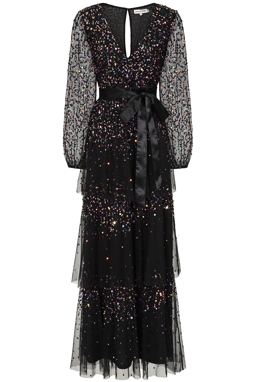 Iris black iridescent sequin maxi dress with V neckline, sheer sleeves and tiered skirt designed for elegant evening and occasion wear styling
