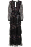 Iris black iridescent sequin maxi dress with V neckline, sheer sleeves and tiered skirt designed for elegant evening and occasion wear styling