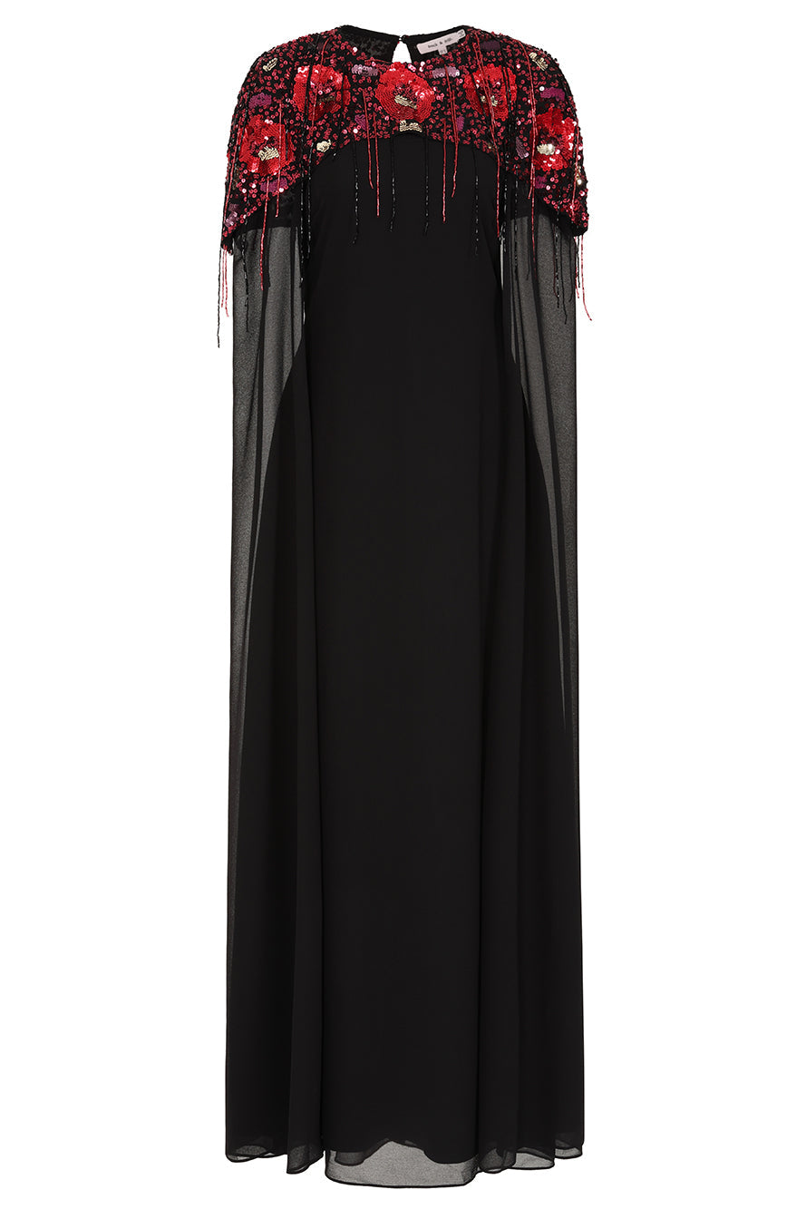 Elegant black maxi cape dress with a relaxed, fluid silhouette and a sheer flowing cape overlay that offers arm and shoulder coverage. The cape is decorated with deep red hand-sequinned floral motifs and cascading beaded tassels that add movement and spar