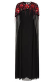 Elegant black maxi cape dress with a relaxed, fluid silhouette and a sheer flowing cape overlay that offers arm and shoulder coverage. The cape is decorated with deep red hand-sequinned floral motifs and cascading beaded tassels that add movement and spar