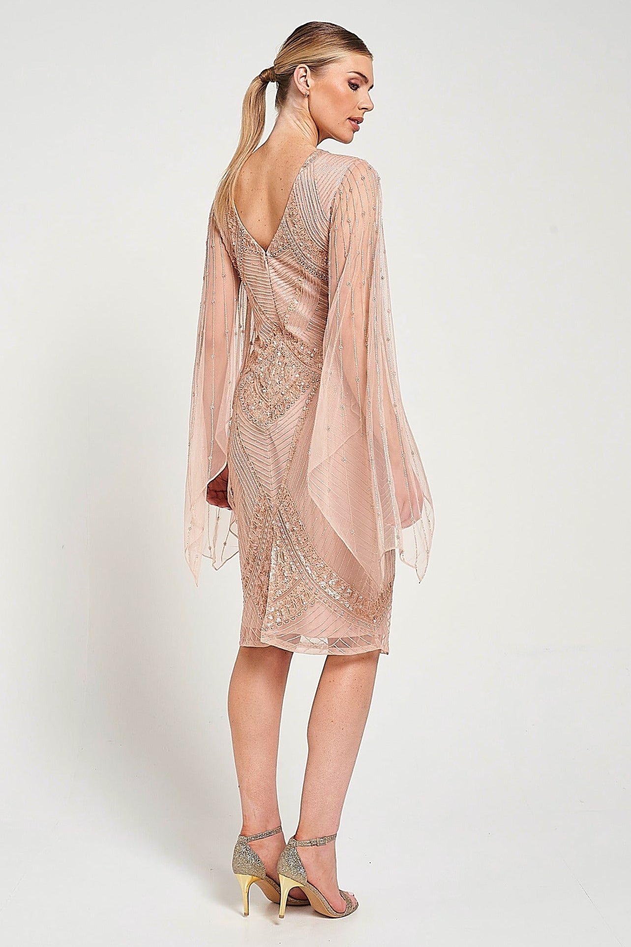 Liora blush embellished midi dress with intricate beading and sheer long sleeves. Perfect for parties and elegant evening occasions.