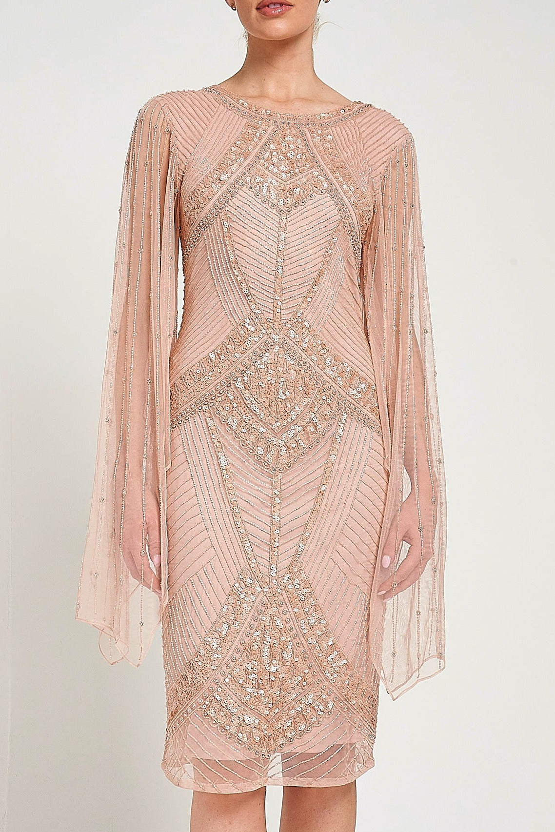 Liora blush embellished midi dress with intricate beading and sheer long sleeves. Perfect for parties and elegant evening occasions.