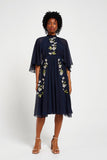 Maeve navy floral embroidered midi dress by Frock and Frill with high neckline, flowing cape sleeves, and elegant silhouette.