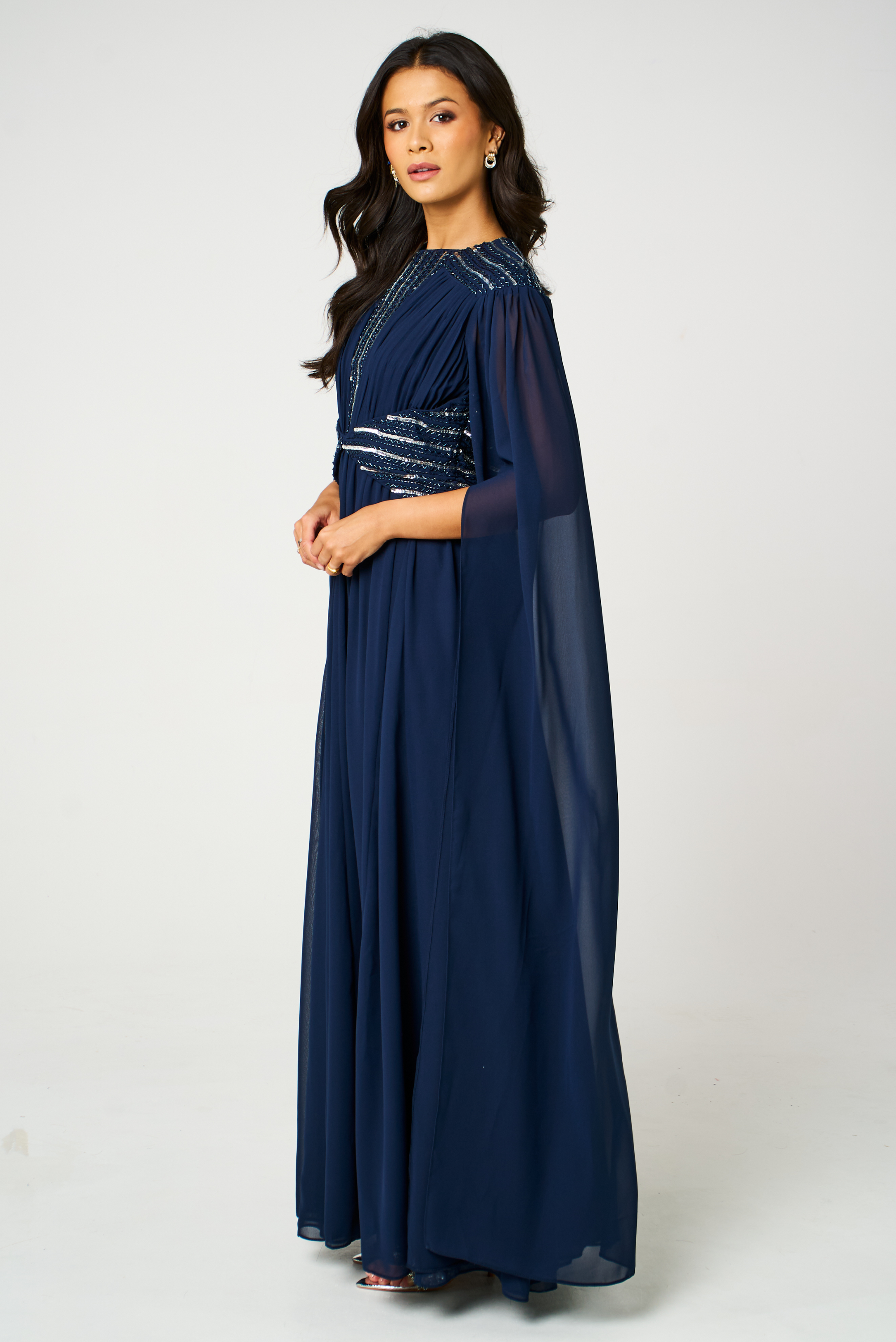 Marina navy embellished maxi dress with flowing silhouette and delicate bead detailing, ideal for weddings and formal occasions.