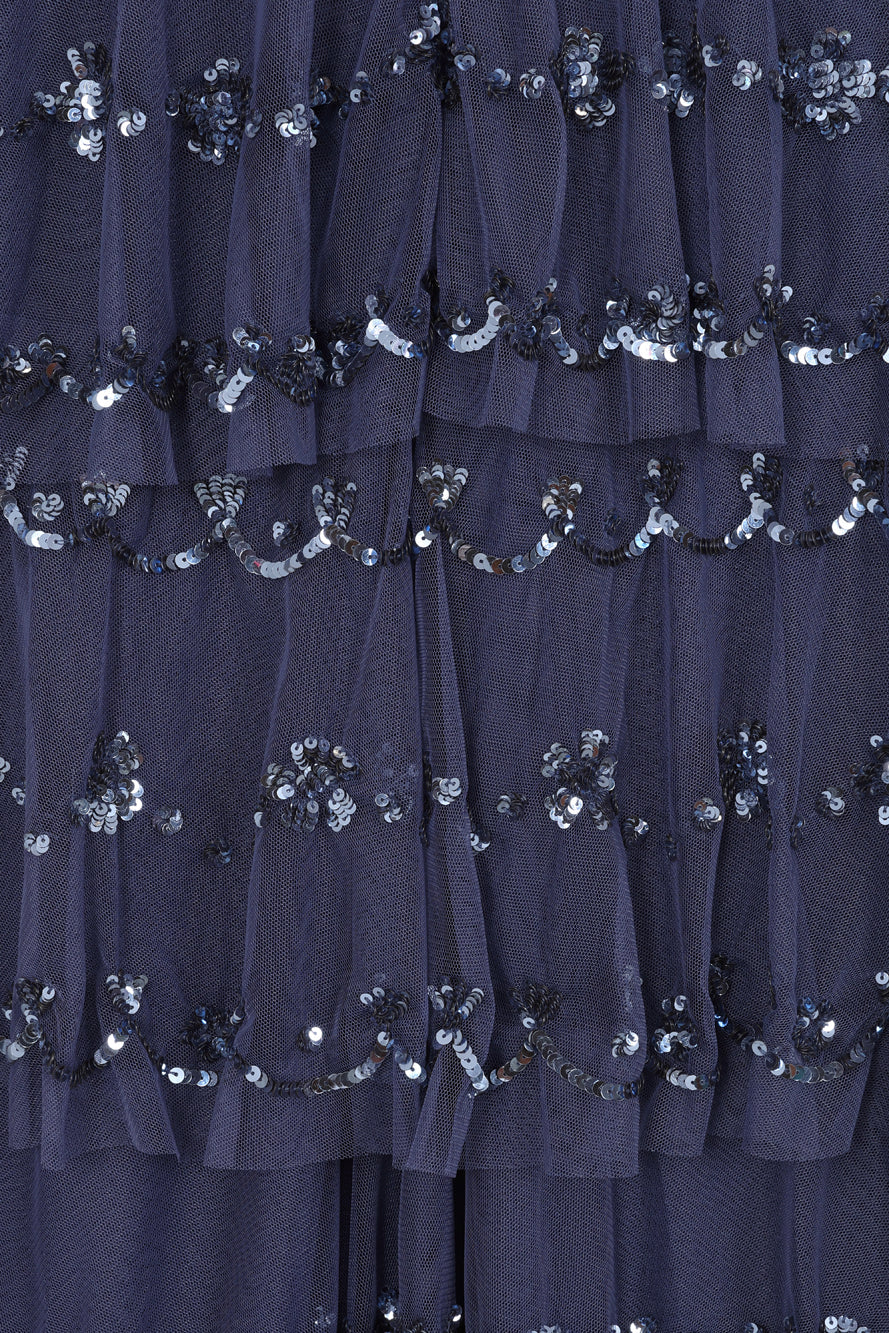 Nerissa dusty navy blue sequin tiered maxi dress with full-length sleeves, perfect for weddings, black tie balls and formal occasions. 