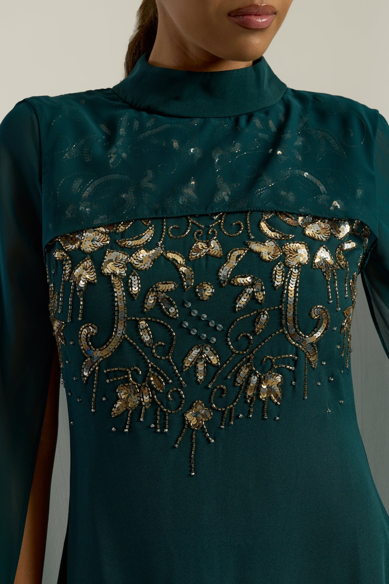 Frock and Frill Paloma Embellished Maxi Dress with cape detail, long sleeves, and flowing silhouette in rainforest green, perfect for weddings and evening events.