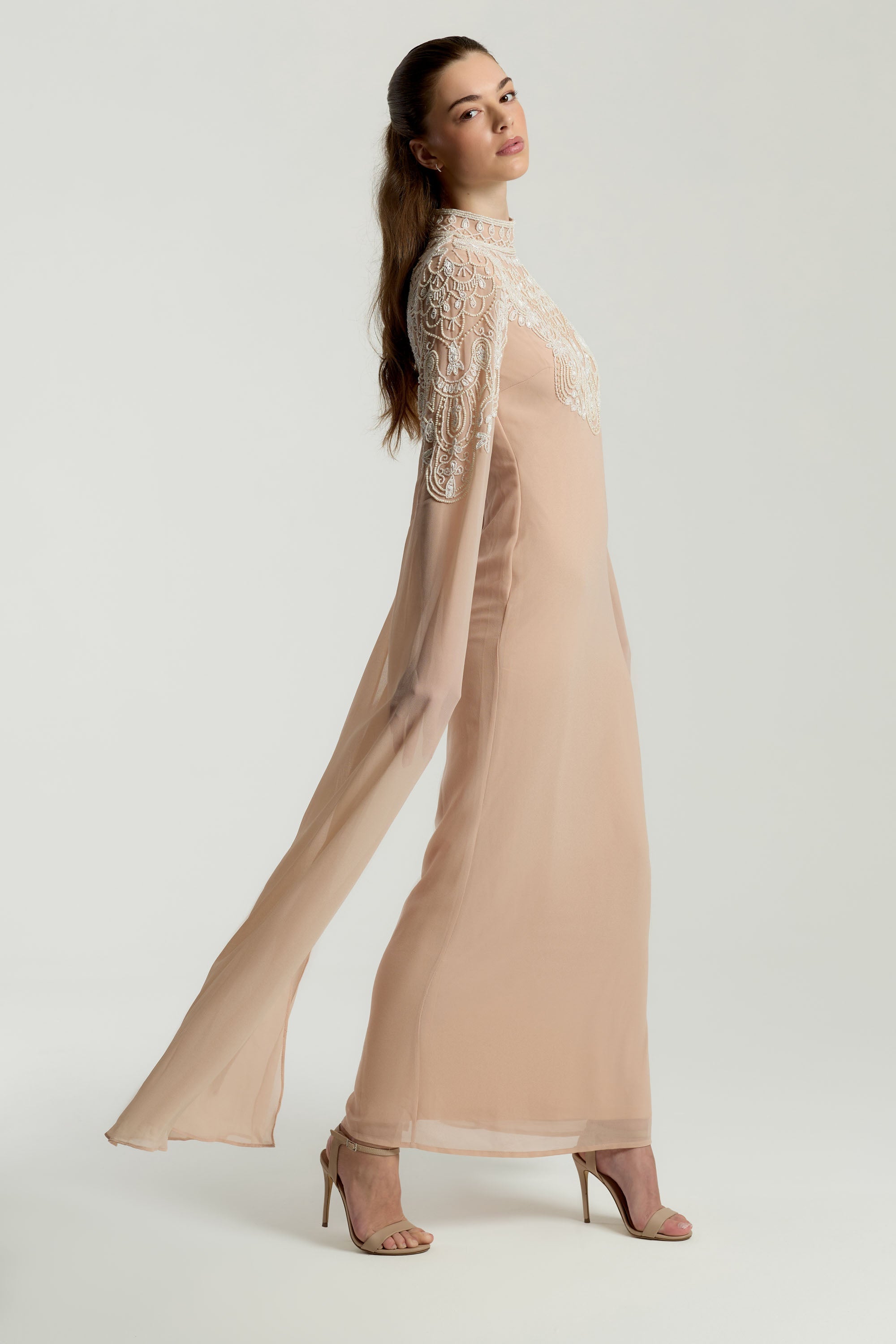 Penelope blush cape maxi dress with white embellishments on bodice and cape sleeves, modest formal dress for weddings and spring occasions