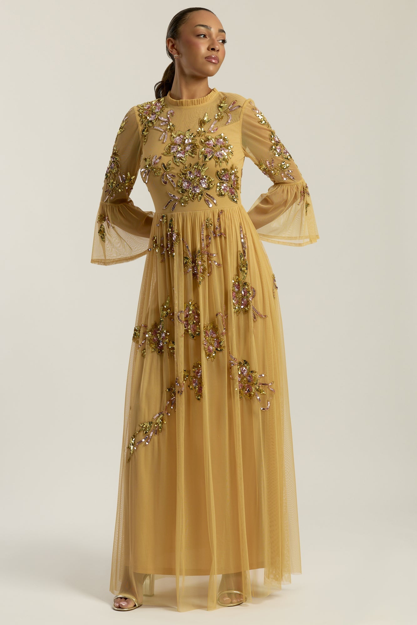 Saffron yellow gold embellished maxi dress with floral beading, sheer three-quarter sleeves and flowing skirt by Frock and Frill.