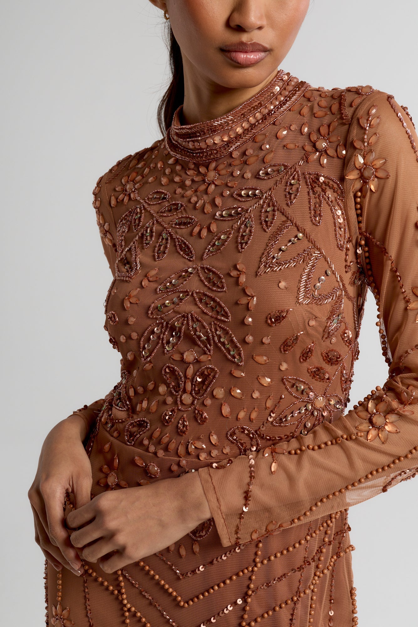 Solene bronze embellished maxi dress with high neckline, side split skirt, and open back, perfect for weddings, formal occasions, and evening events.