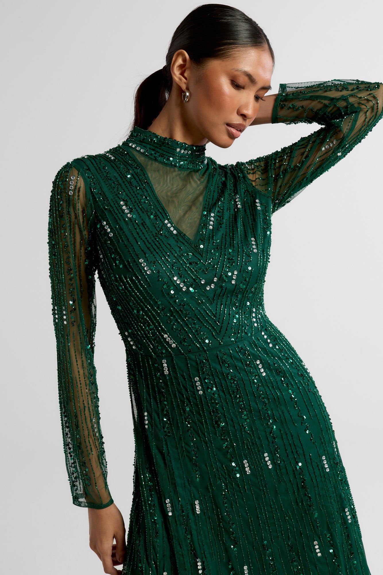 Sophia green high neck embellished maxi dress with full length sleeves and intricate embellishment, suitable for weddings and formal occasions.