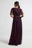 Talia dark purple embellished maxi dress with long sleeves, beaded bodice, and flowing skirt, suitable for bridesmaids or formal occasions.