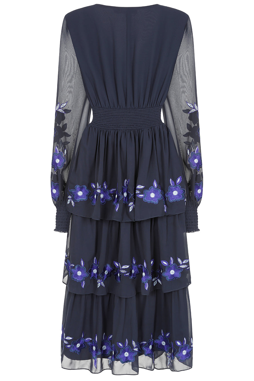 Frock & Frill Tamsin navy floral embroidered midi dress with tiered chiffon skirt, sheer long sleeves, and vibrant blue embroidered detailing—perfect for weddings and special occasions.