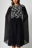 Una black embellished cape sleeve midi dress by Frock and Frill with silver bodice detailing, high neckline and flared skirt designed for elegant occasion wear styling