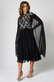 Una black embellished cape sleeve midi dress by Frock and Frill with silver bodice detailing, high neckline and flared skirt designed for elegant occasion wear styling