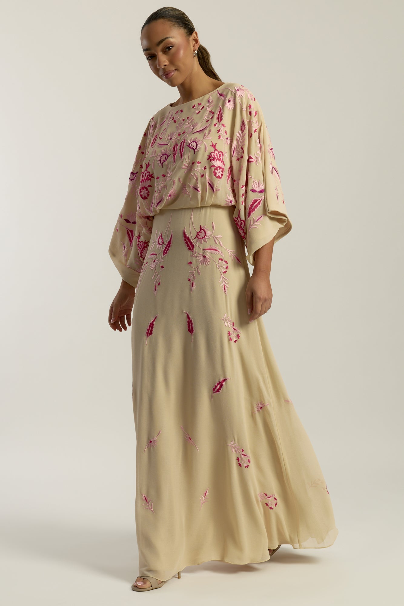 Viola nude embroidered maxi dress with long sleeves, floor-length silhouette, and floral detailing, perfect for weddings, formal events, and modest occasions.