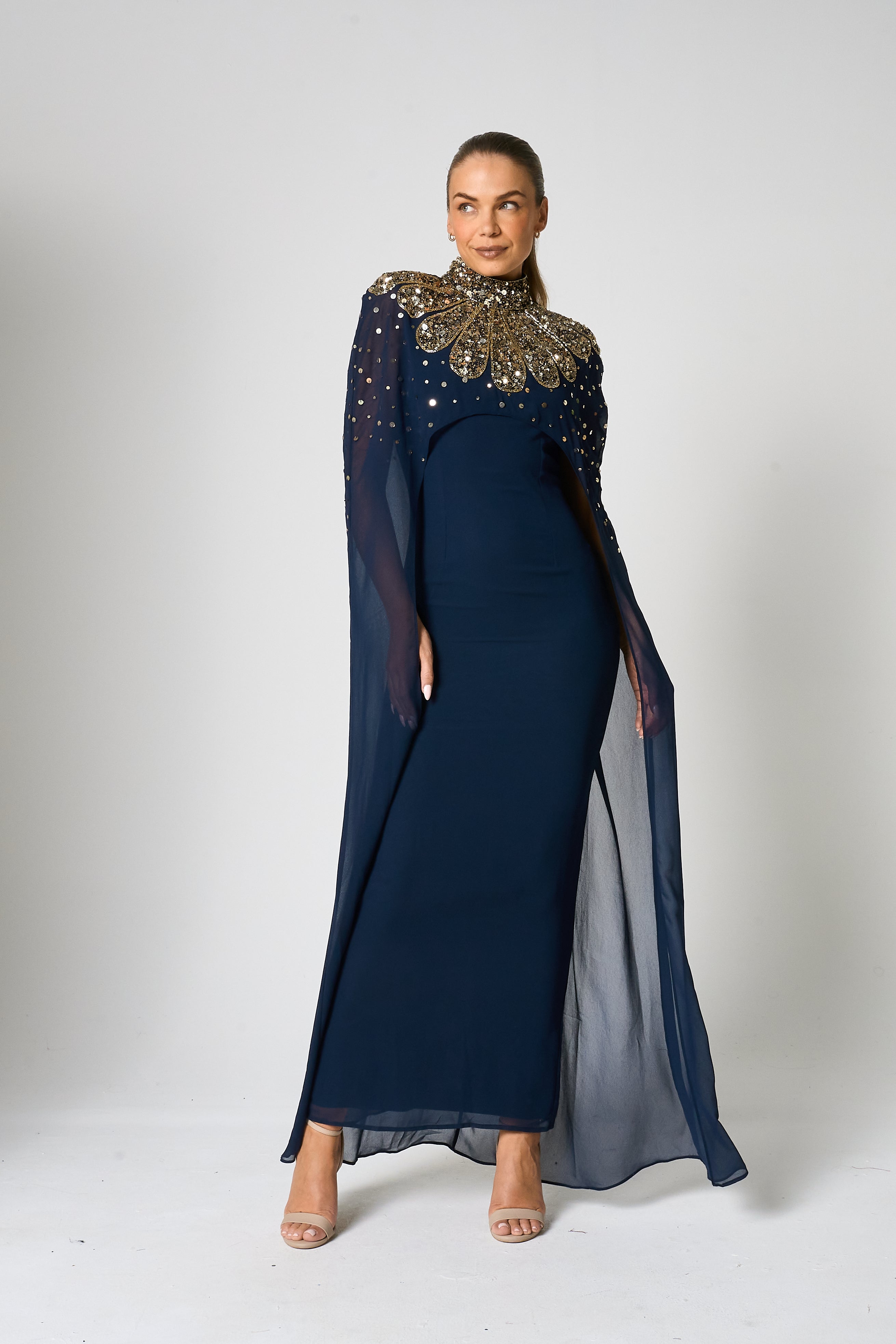 Zadie Navy Embellished Cape Maxi Dress with gold embellished neckline and flowing sheer cape