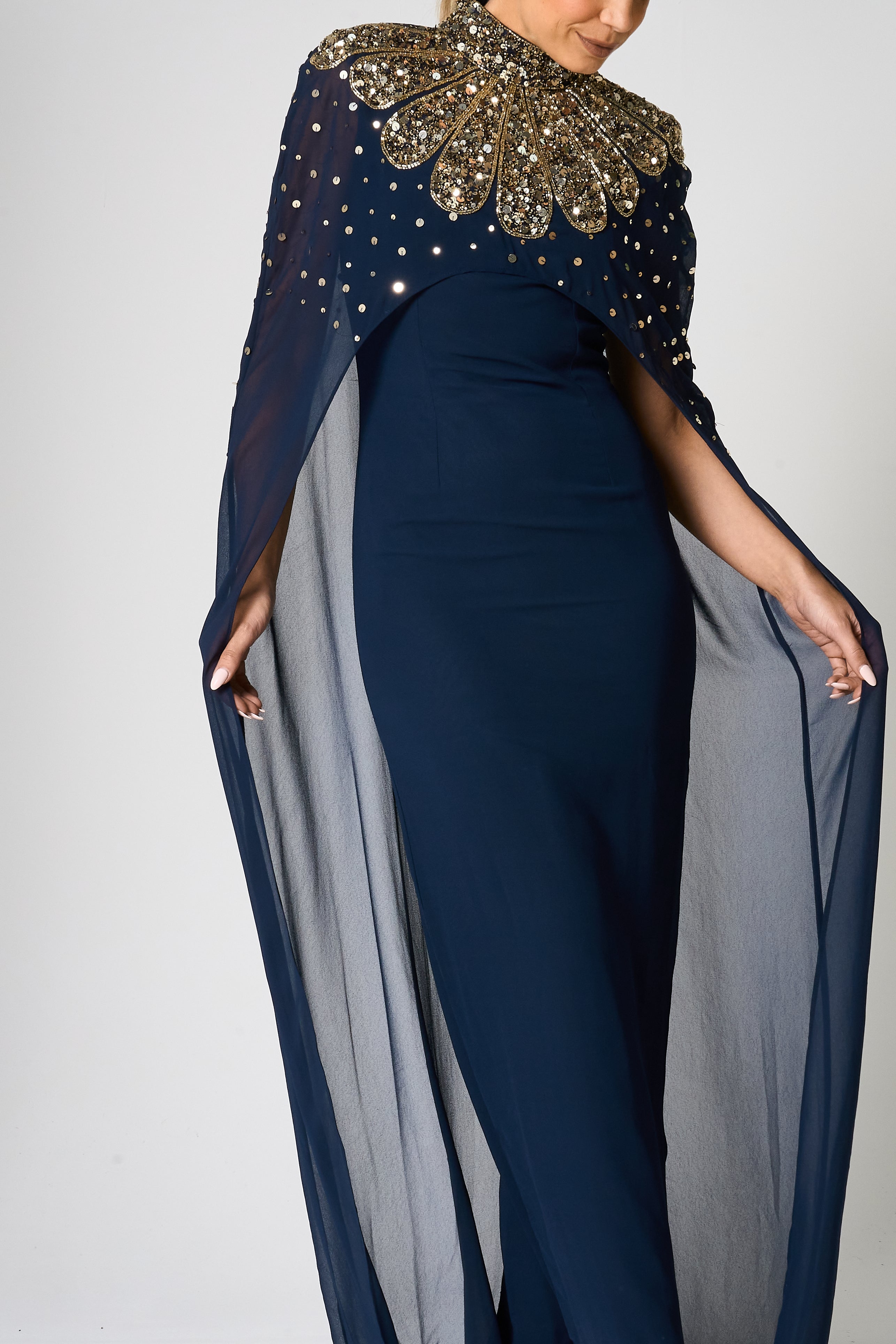 Zadie Navy Embellished Cape Maxi Dress with gold embellished neckline and flowing sheer cape