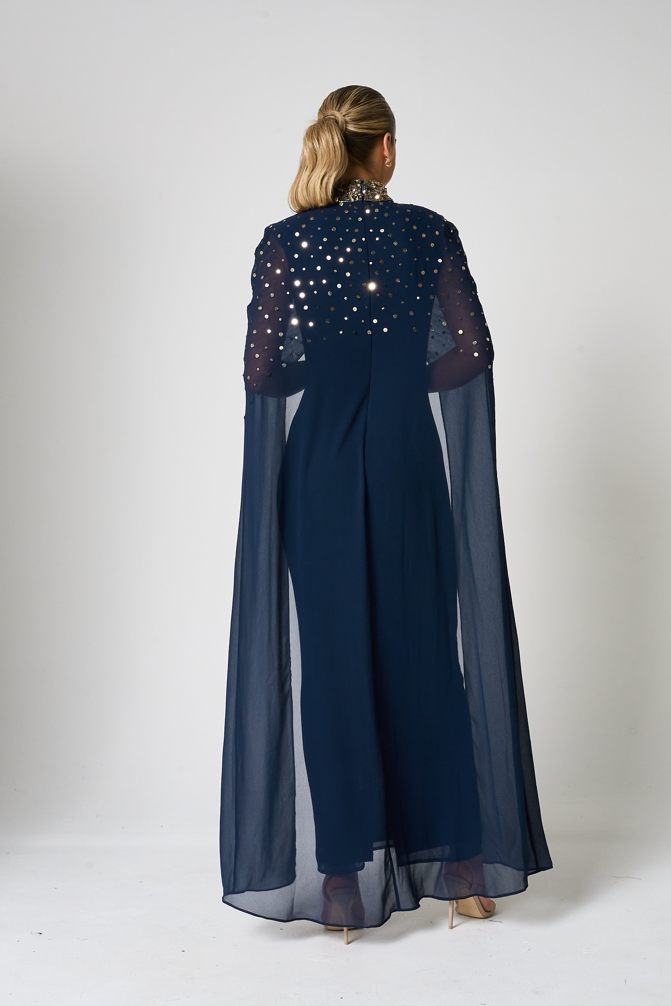 Zadie Navy Embellished Cape Maxi Dress with gold embellished neckline and flowing sheer cape