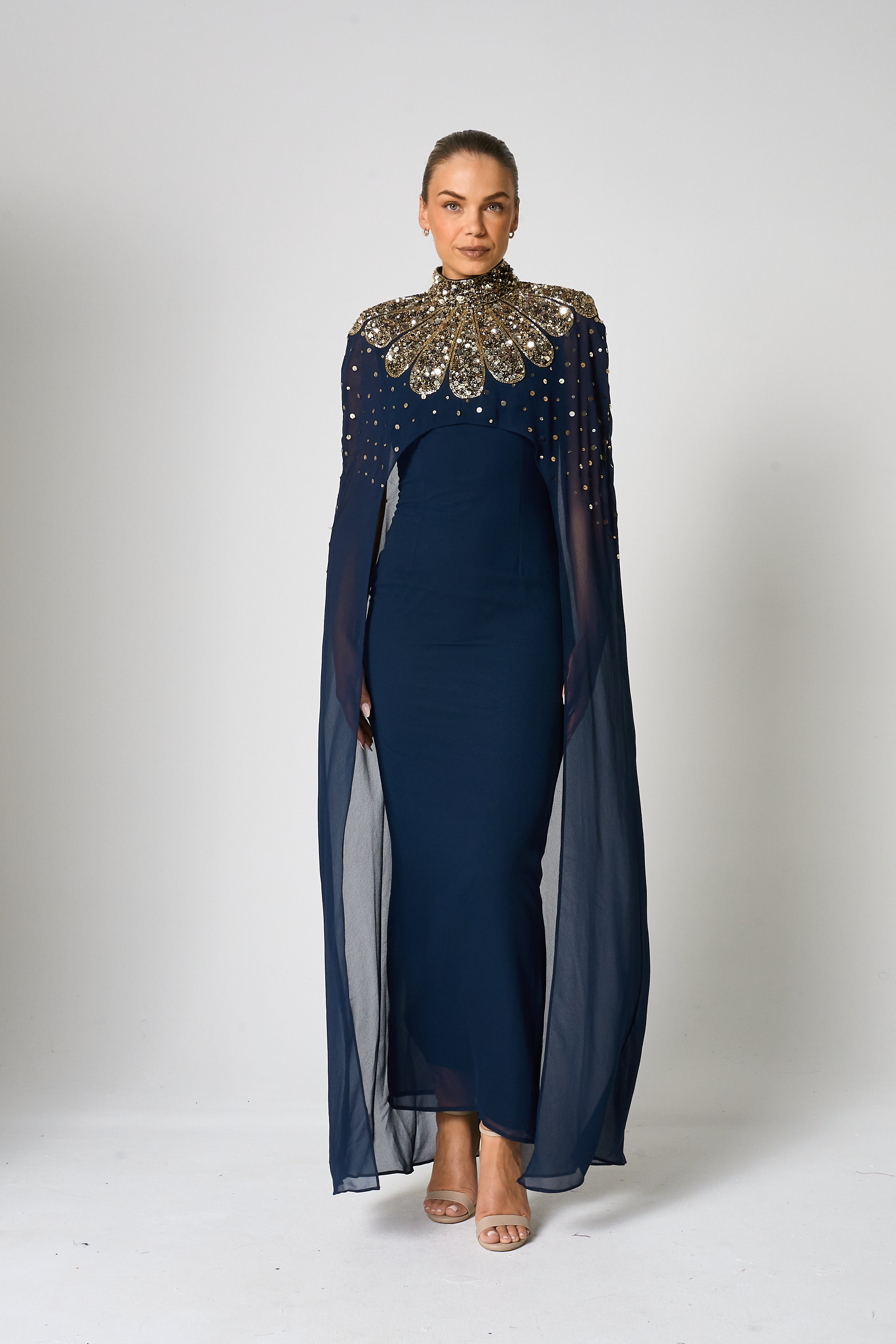 Zadie Navy Embellished Cape Maxi Dress with gold embellished neckline and flowing sheer cape